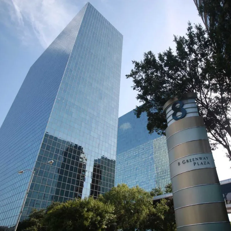 Glass skyscraper and sign for 8 Greenway Plaza.